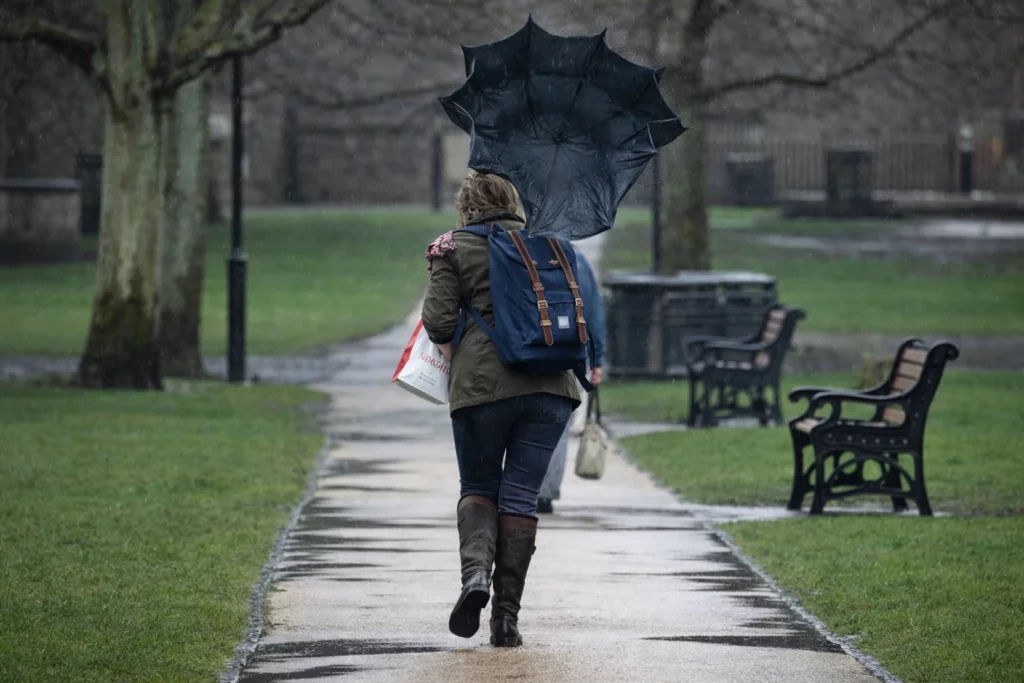 Students running from bad weather in southampton